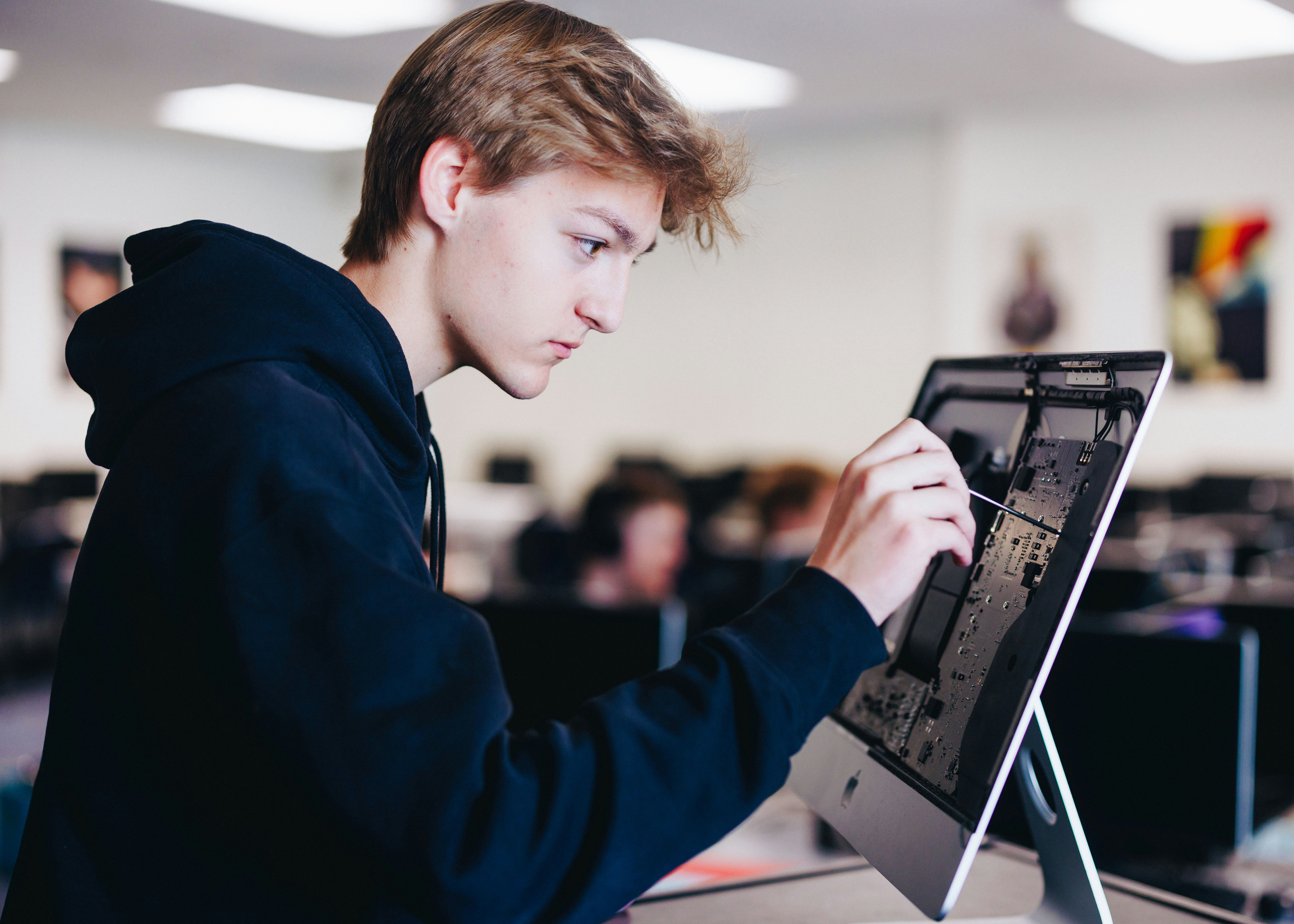 Male student working on a computer project